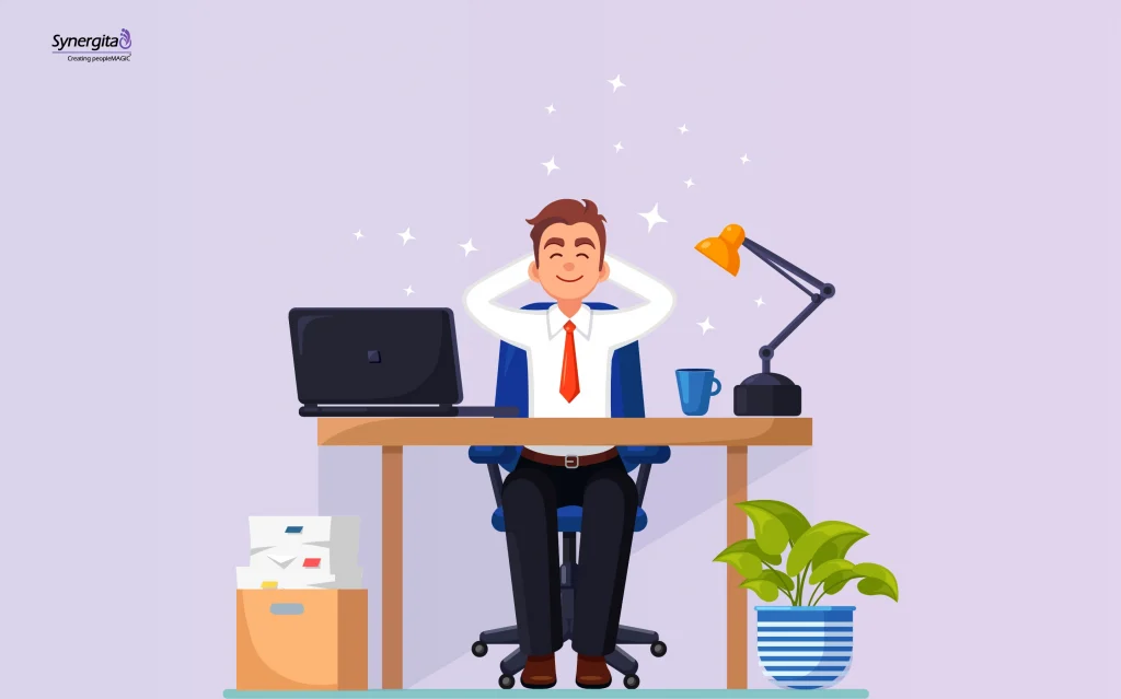 Employee at a workspace appearing happy and satisfied, reflecting how feeling valued at work contributes to employee happiness.